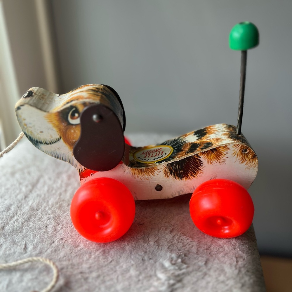 Vintage Little Snoopy Pull Toy with Red Wheels 1968